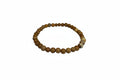 Wooden beaded bracelet on a white surface