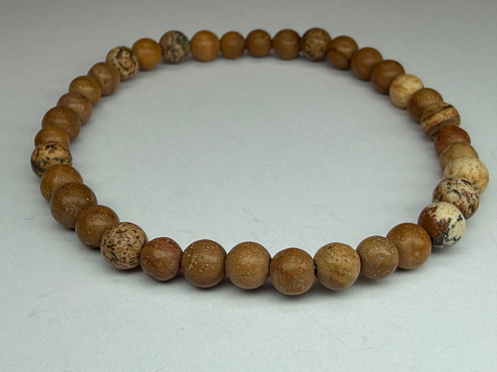 Wooden beaded bracelet on a light gray background