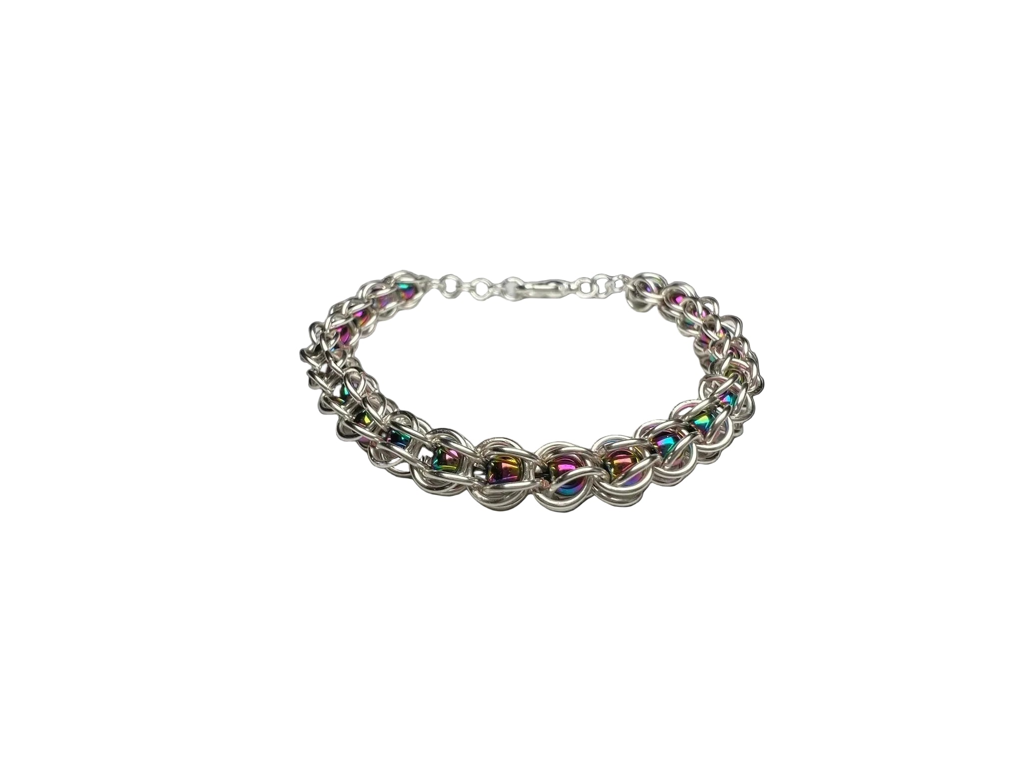 Silver chainmaille bracelet on a white surface
