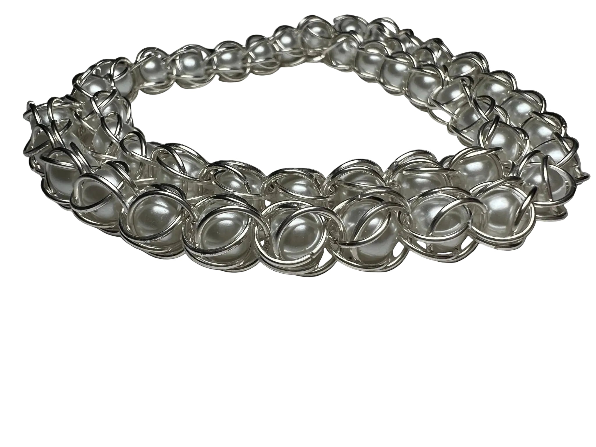 Silver chain necklace on a gray background