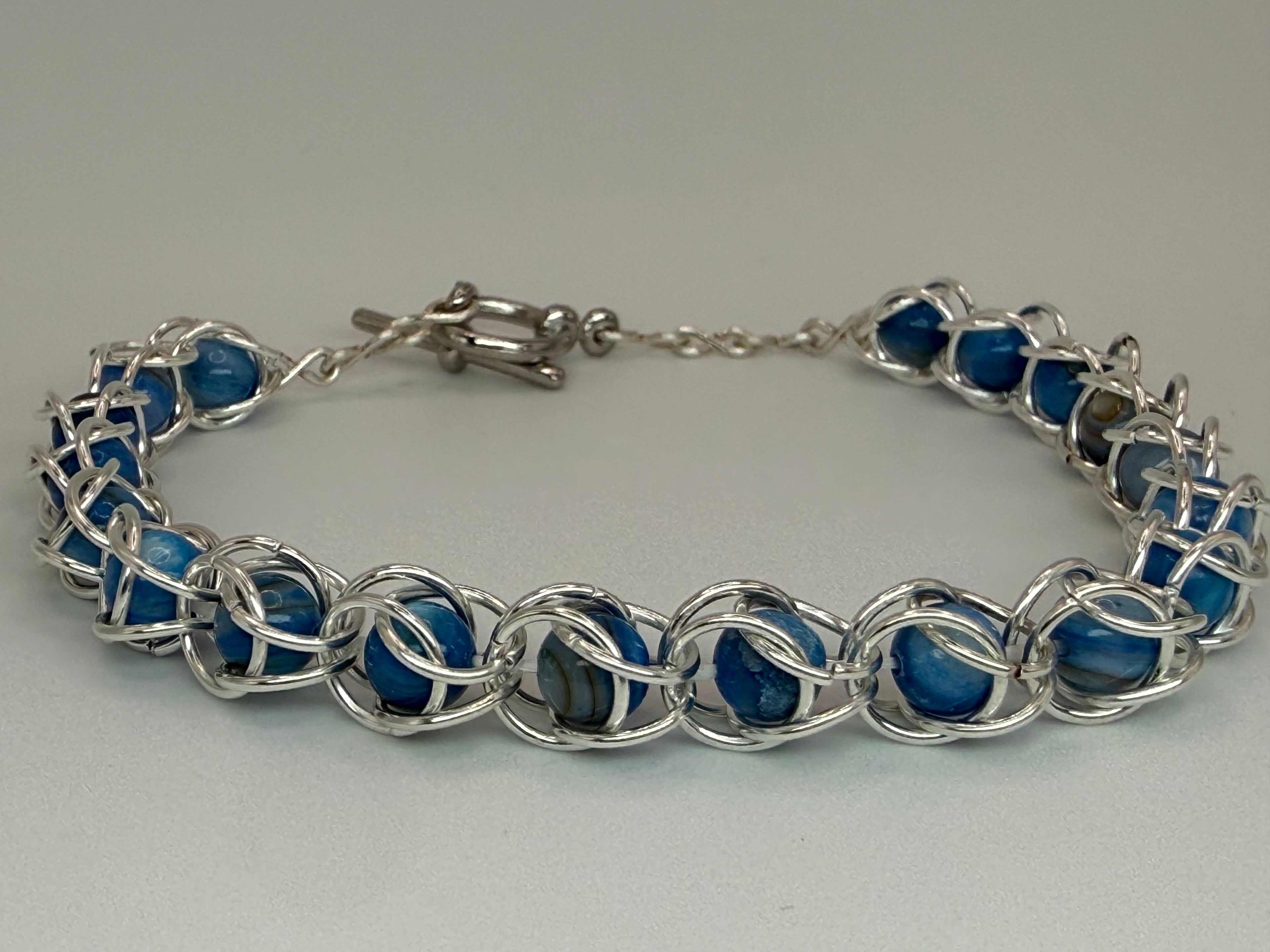 Captured Bead Bracelet with Blue Shell Iridescent Beads