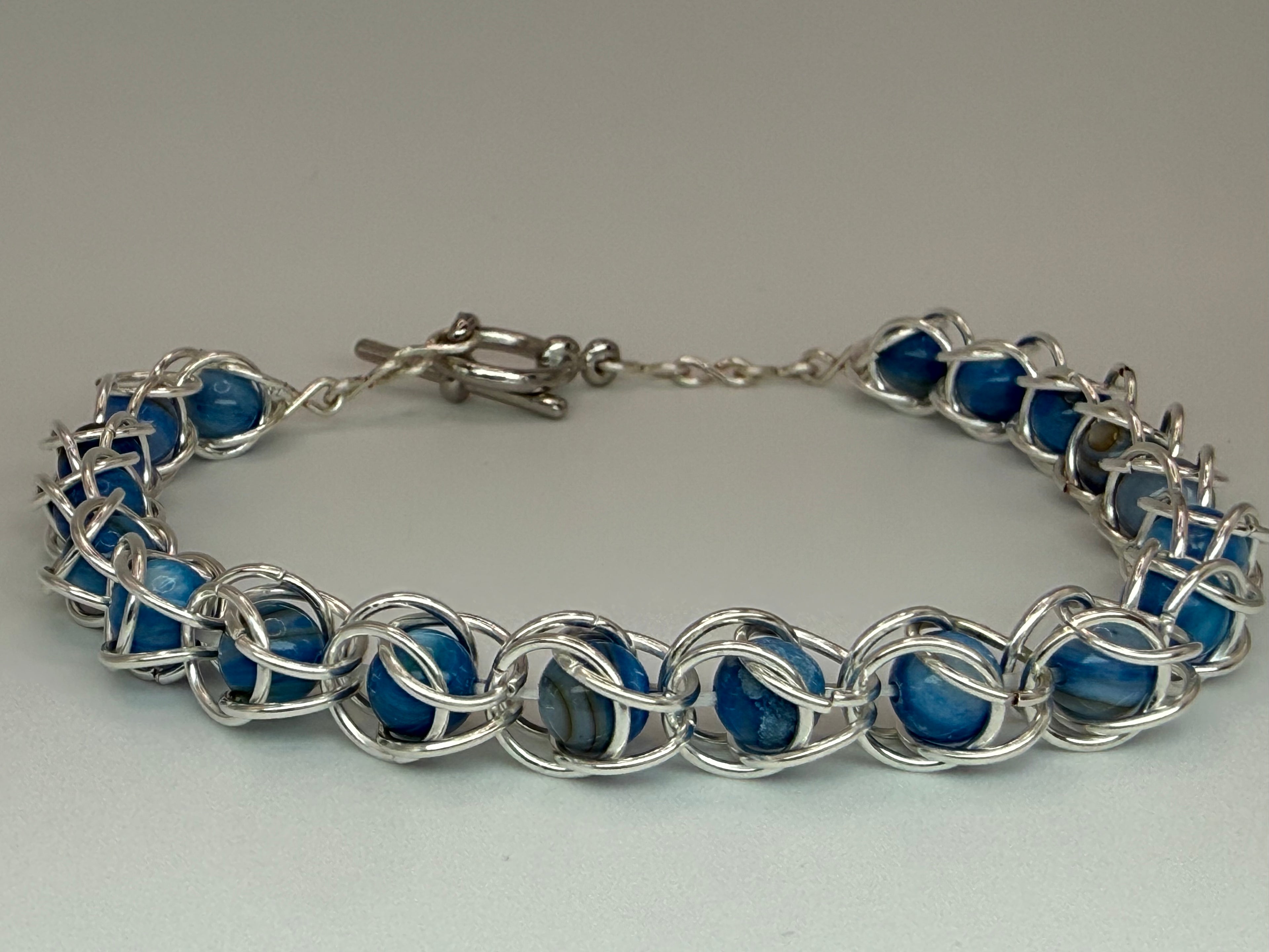 Captured Bead Bracelet with Blue Shell Iridescent Beads