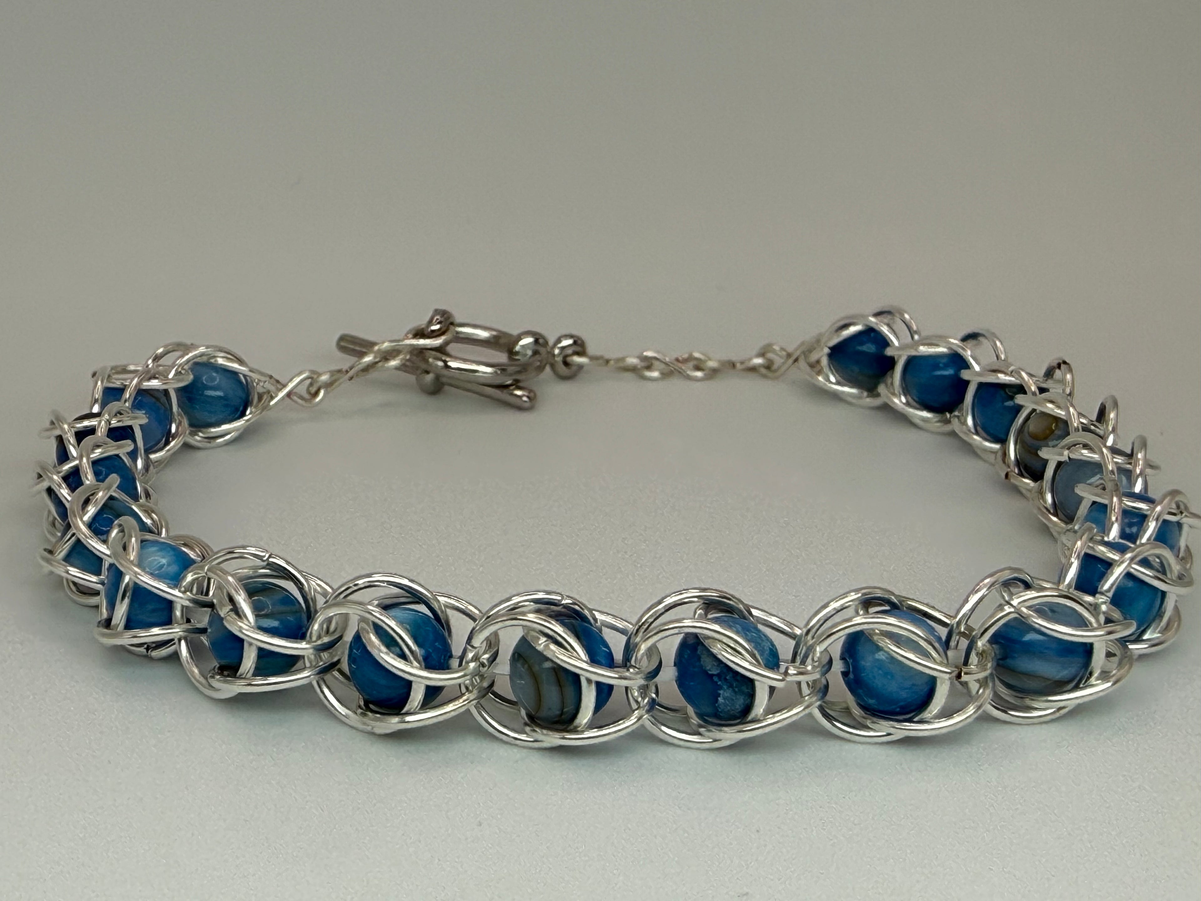 Captured Bead Bracelet with Blue Shell Iridescent Beads