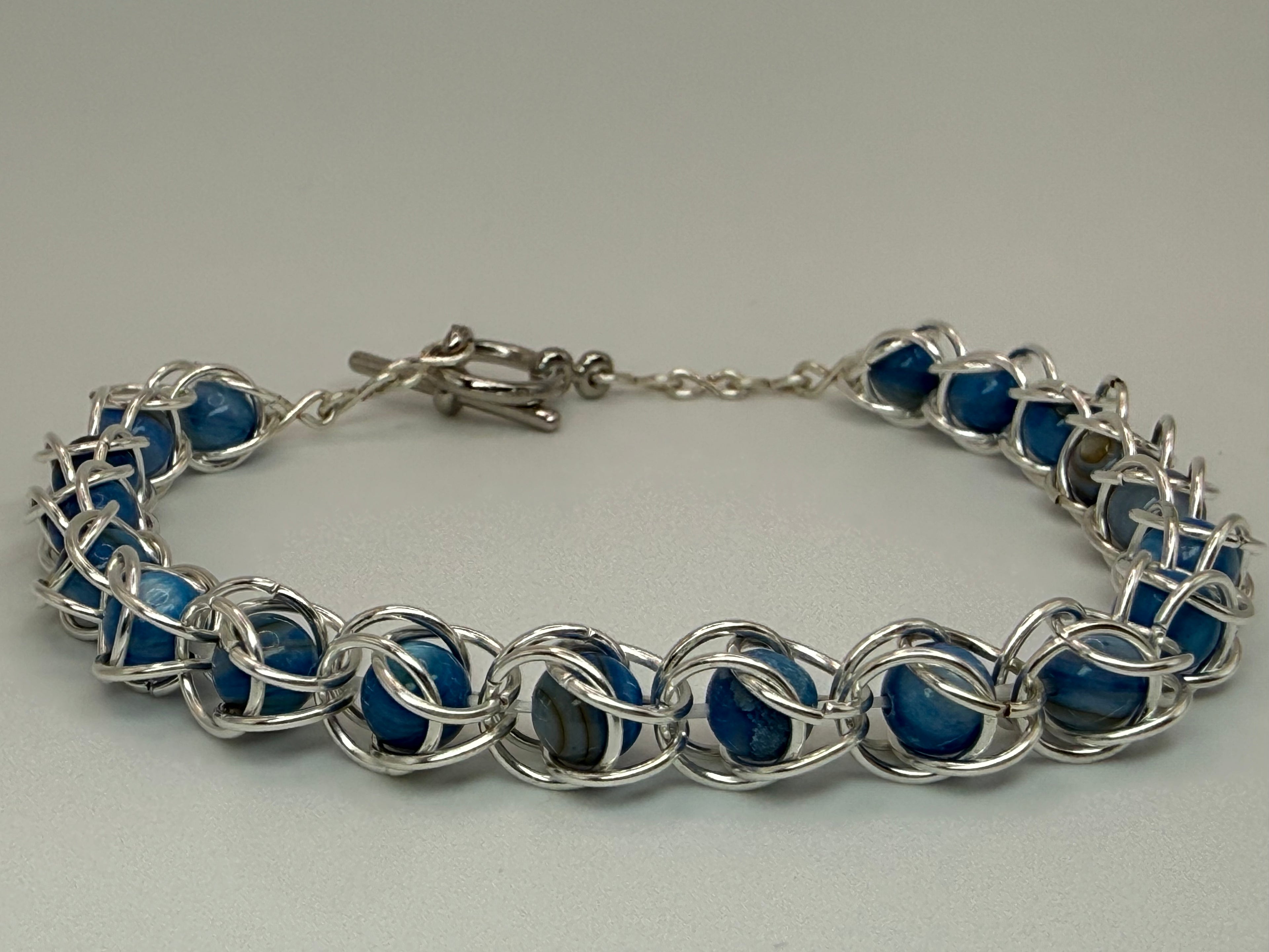 Captured Bead Bracelet with Blue Shell Iridescent Beads